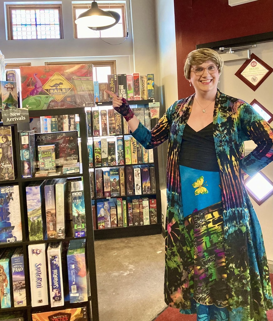 Ann Journey, Cretaceous Rails creator, poses with the game at Spielbound.
