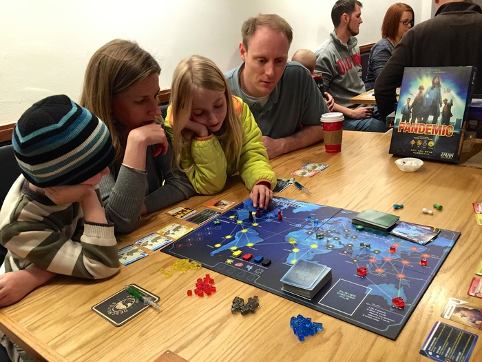 UNMC staff and family playing Pandemic and raising funds for Doctors Without Borders